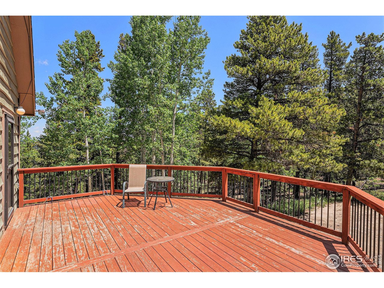 147 St Vrain Trail Ward, CO 80481 - Photo 6 of 31 a view of balcony with wooden floor and seating space