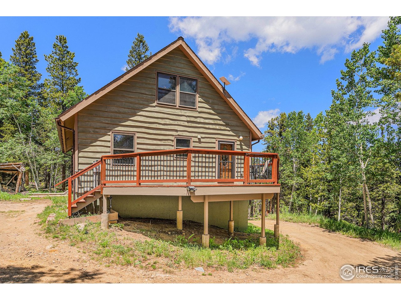 147 St Vrain Trail Ward, CO 80481 - Photo 8 of 31 a view of a house with a yard