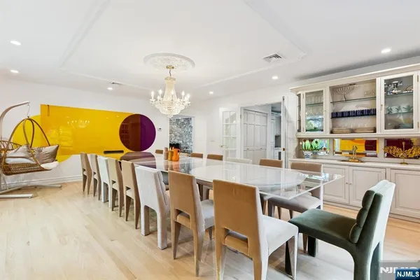 a dining room with a table and chairs
