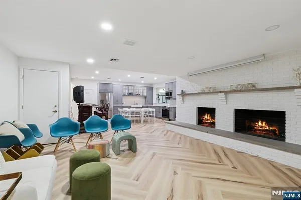 a living room with furniture a fireplace and a fireplace