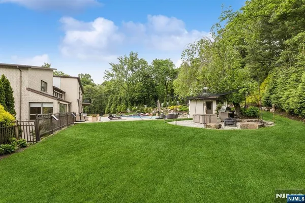 a view of a house with a yard porch and sitting area