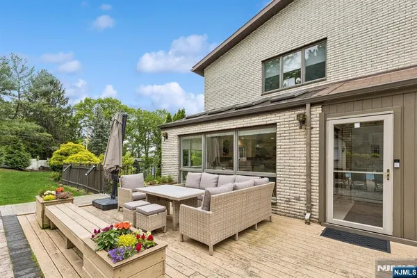 a view of a garden with lawn chairs