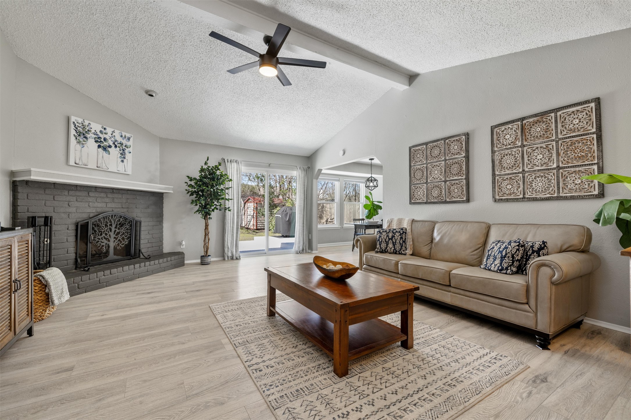 11302 Windermere Meadows Austin, TX 78759 - Photo 1 of 1 a living room with furniture and a fireplace