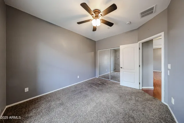 a view of a livingroom with a ceiling fan