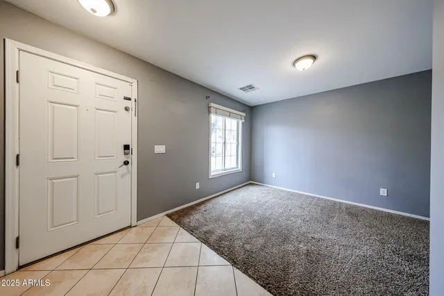 a view of an empty room and window