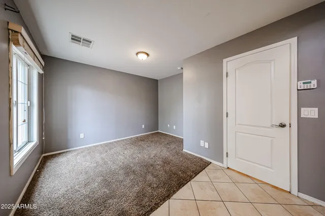 a view of an empty room and window