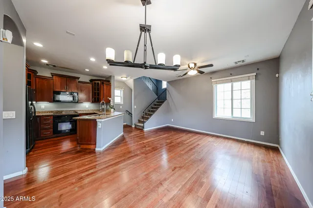 a view of a kitchen and wooden floor