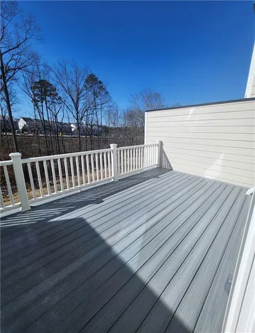 a view of balcony with wooden floor