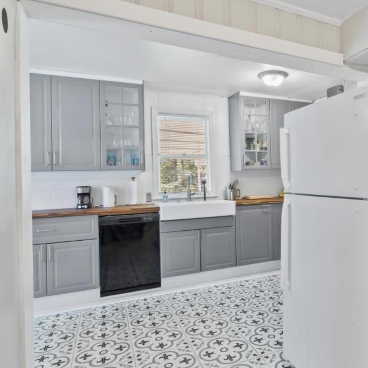 1049 McEvers Road Memphis, TN 38111 - Photo 17 of 28 a kitchen with a refrigerator and a sink