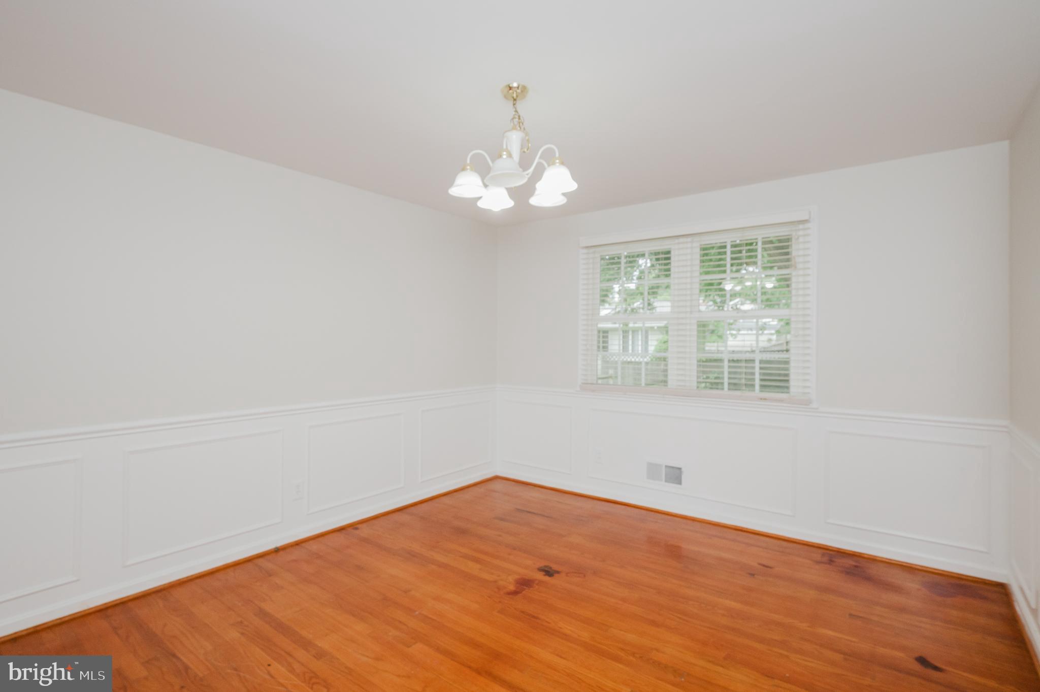 4 Old Spring Court Cockeysville, MD 21030 - Photo 7 of 53 wooden floor in an empty room with a window