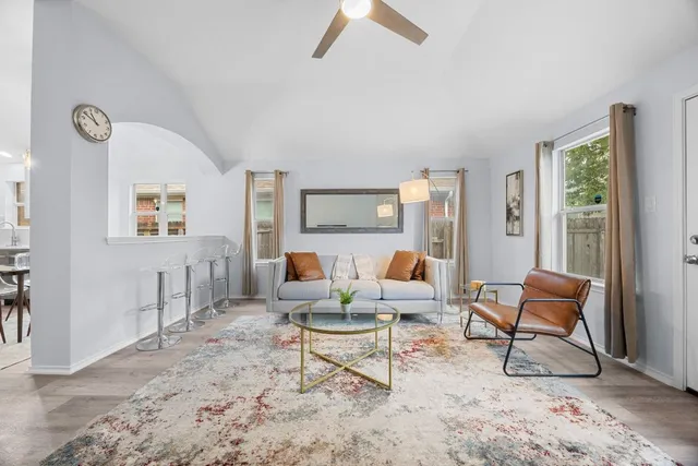 a living room with furniture and a rug