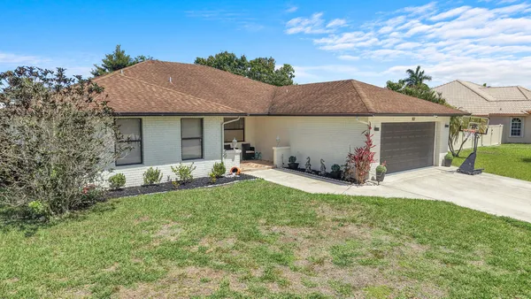 a front view of a house with a yard