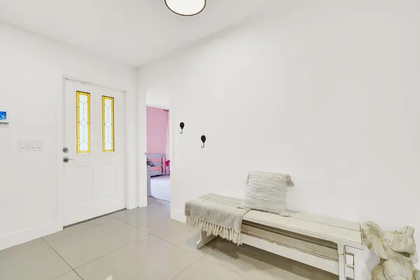 a living room with furniture and white walls