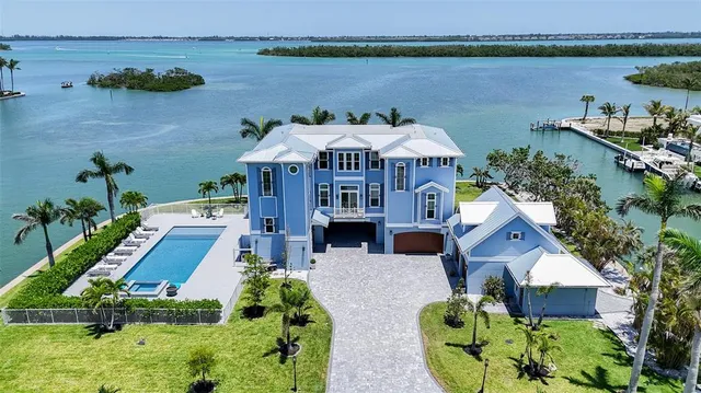 a kitchen with granite countertop a table chairs stove and cabinets