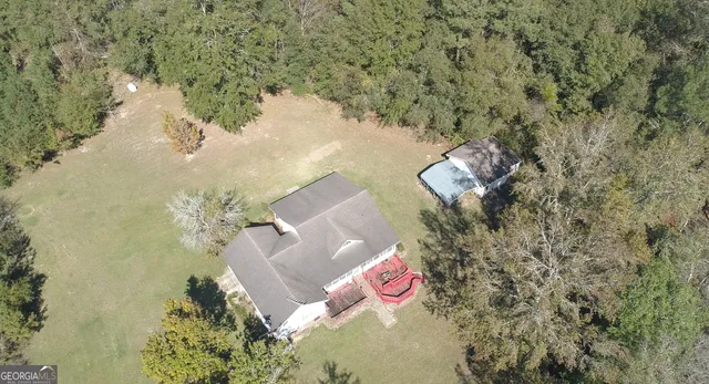 a backyard of a house with lots of green space
