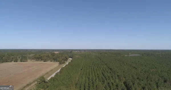 a view of an ocean beach and mountain