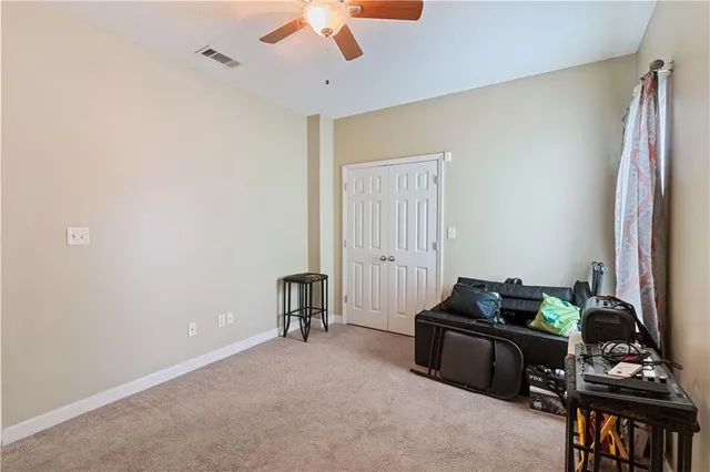 a bedroom with furniture and a window