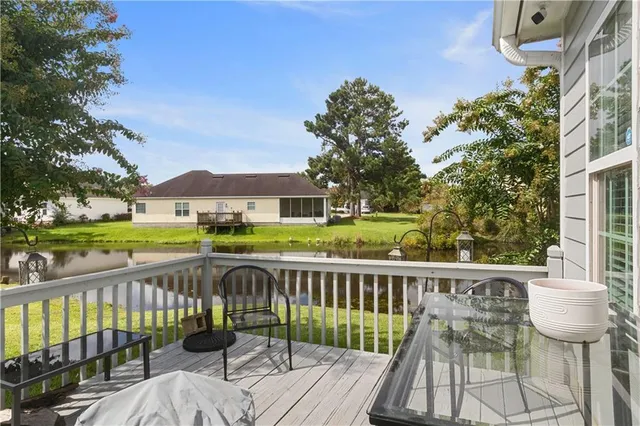a view of a deck with two chair and table