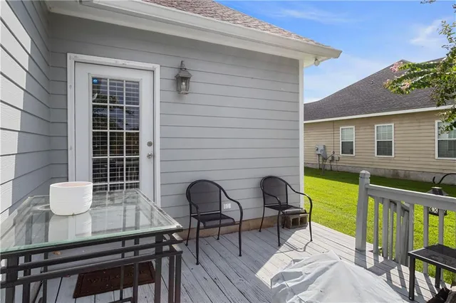 a view of a chairs and table in the patio