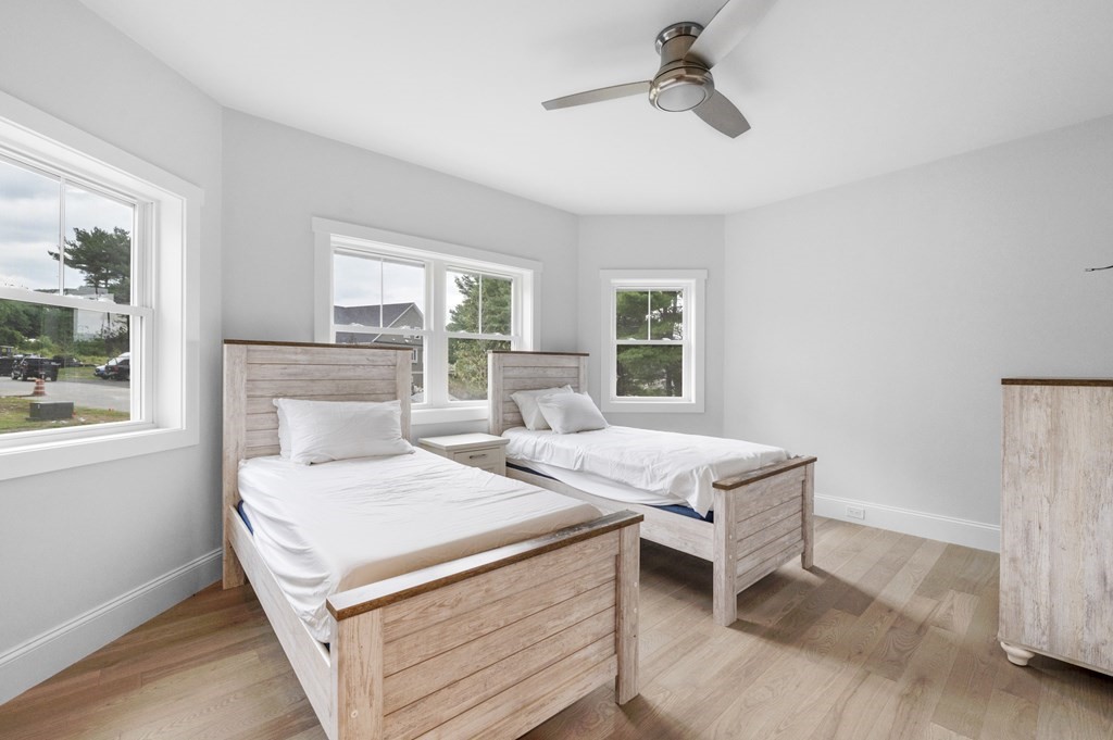 30 Pne Hl Road, Unit 30 Wenham, MA 01984 - Photo 21 of 32 a bedroom with a bed and large windows