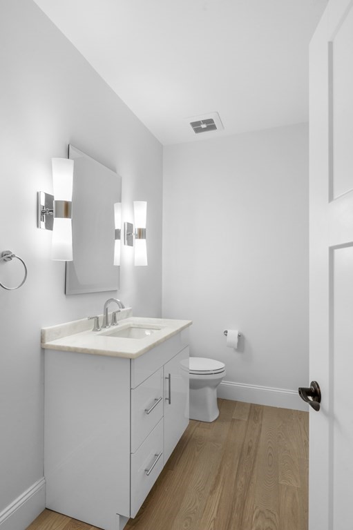30 Pne Hl Road, Unit 30 Wenham, MA 01984 - Photo 26 of 32 a bathroom with a toilet a sink and mirror