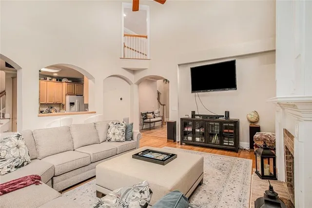 a kitchen with a sink a stove cabinets and a dining table