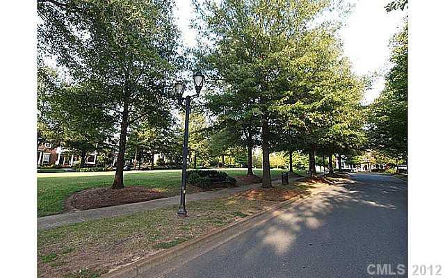 290 Elis Way, Unit 153 Fort Mill, SC 29708 - Photo 14 of 16 a view of a yard with a tree