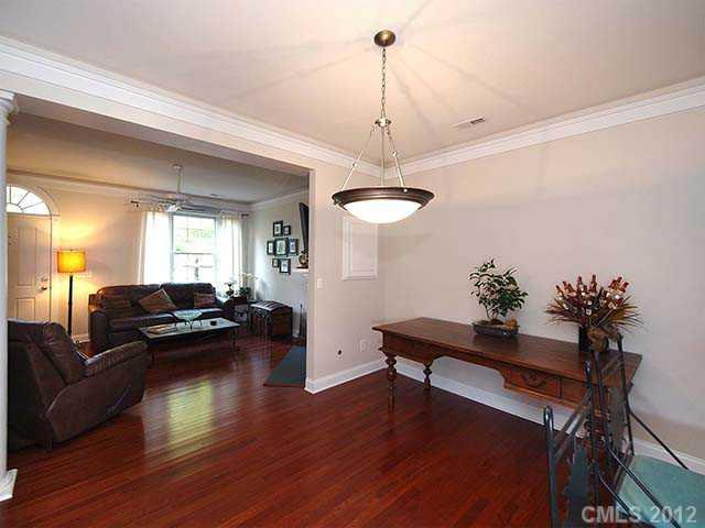 290 Elis Way, Unit 153 Fort Mill, SC 29708 - Photo 5 of 16 a living room with furniture and a wooden floor