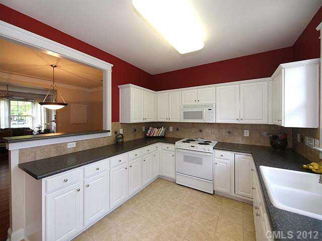 290 Elis Way, Unit 153 Fort Mill, SC 29708 - Photo 6 of 16 a kitchen with a sink and cabinets