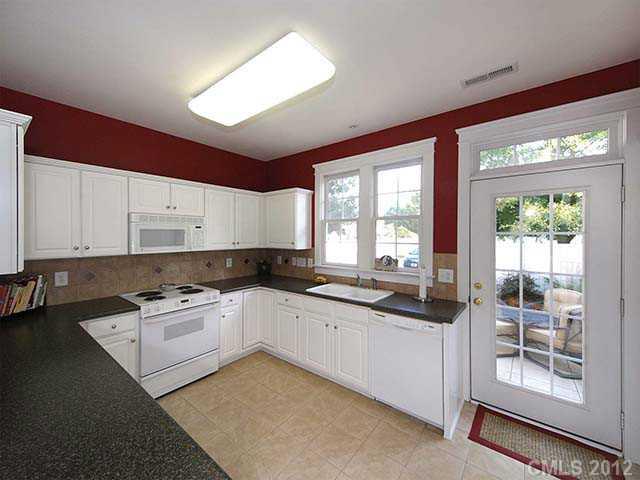 290 Elis Way, Unit 153 Fort Mill, SC 29708 - Photo 7 of 16 a kitchen with a sink stove and cabinets