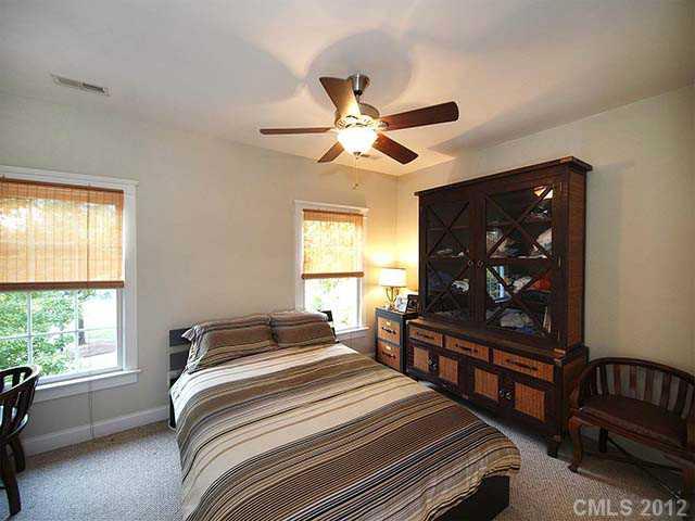 290 Elis Way, Unit 153 Fort Mill, SC 29708 - Photo 8 of 16 a bedroom with a bed and a dresser next to a window