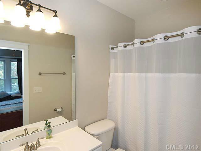290 Elis Way, Unit 153 Fort Mill, SC 29708 - Photo 9 of 16 a bathroom with a sink toilet and shower