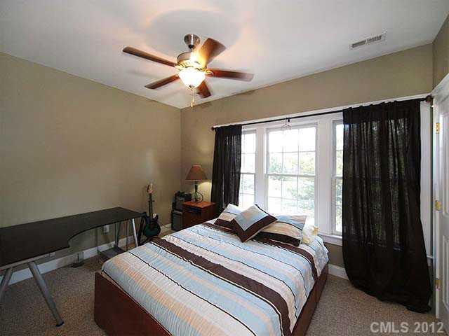 290 Elis Way, Unit 153 Fort Mill, SC 29708 - Photo 10 of 16 a bedroom with a bed and a window