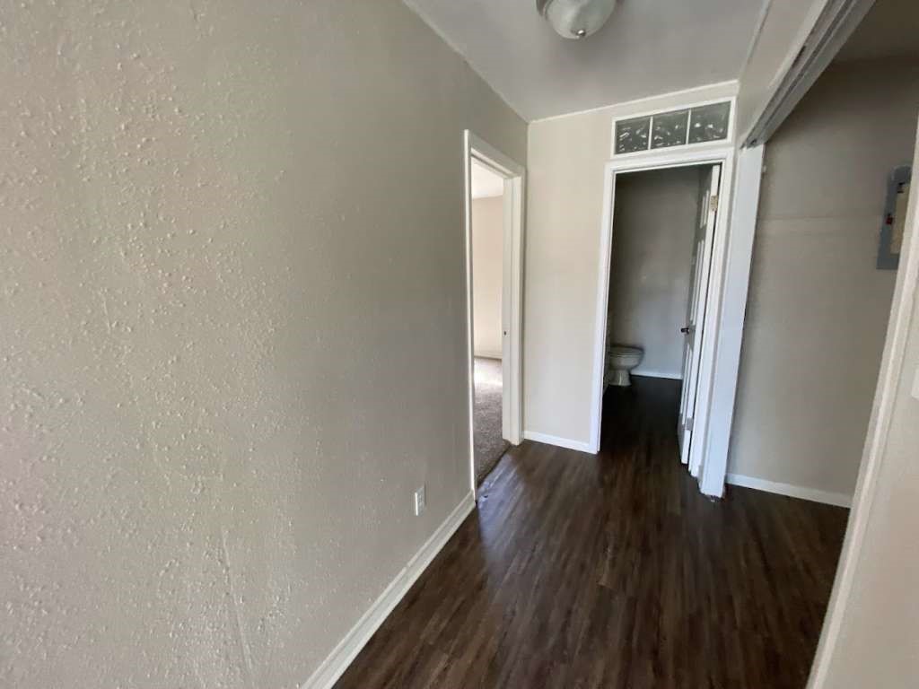 201 Ferguson Drive Cleveland, TX 77327 - Photo 18 of 38 a view of a hallway with wooden floor and closet