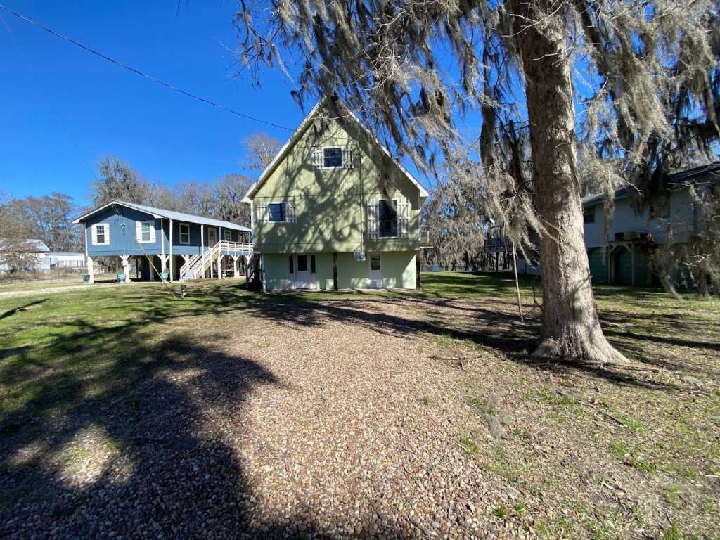 201 Ferguson Drive Cleveland, TX 77327 - Photo 5 of 38 a view of house with a yard