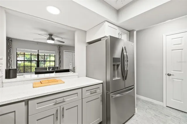 a kitchen with stainless steel appliances a refrigerator and a sink