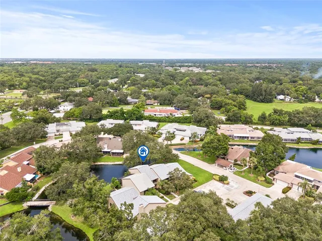 an aerial view of residential houses with outdoor space