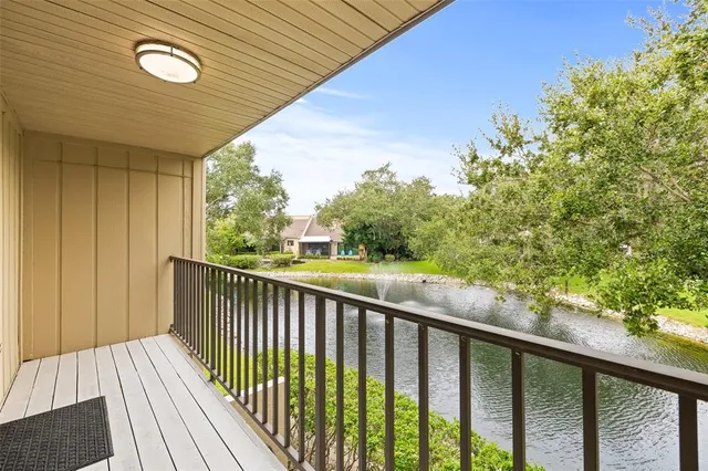 a view of a balcony with wooden floor