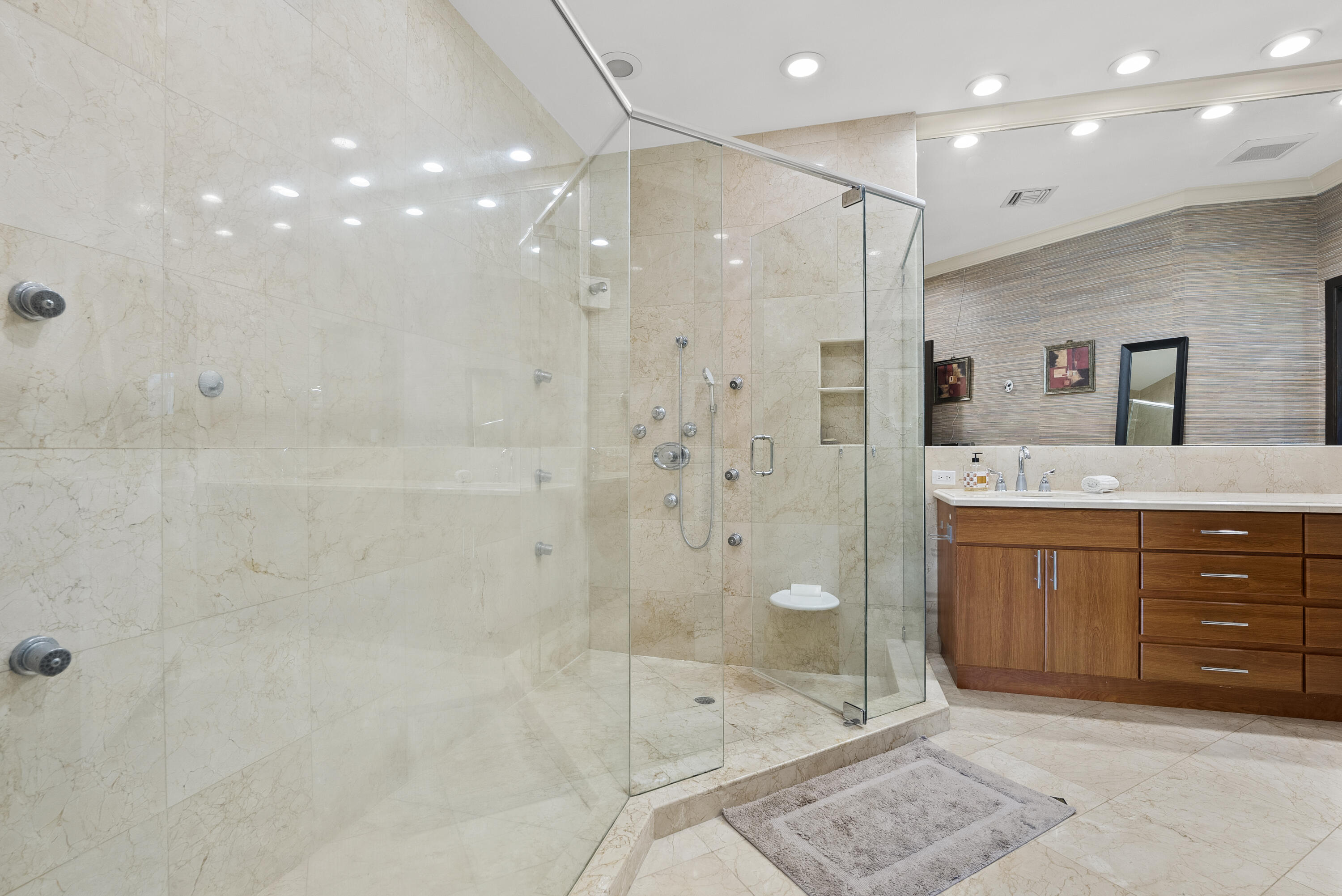 2245 Southwest 16th Place Boca Raton, FL 33486 - Photo 18 of 40 a bathroom with a granite countertop sink a shower a mirror and a bathtub