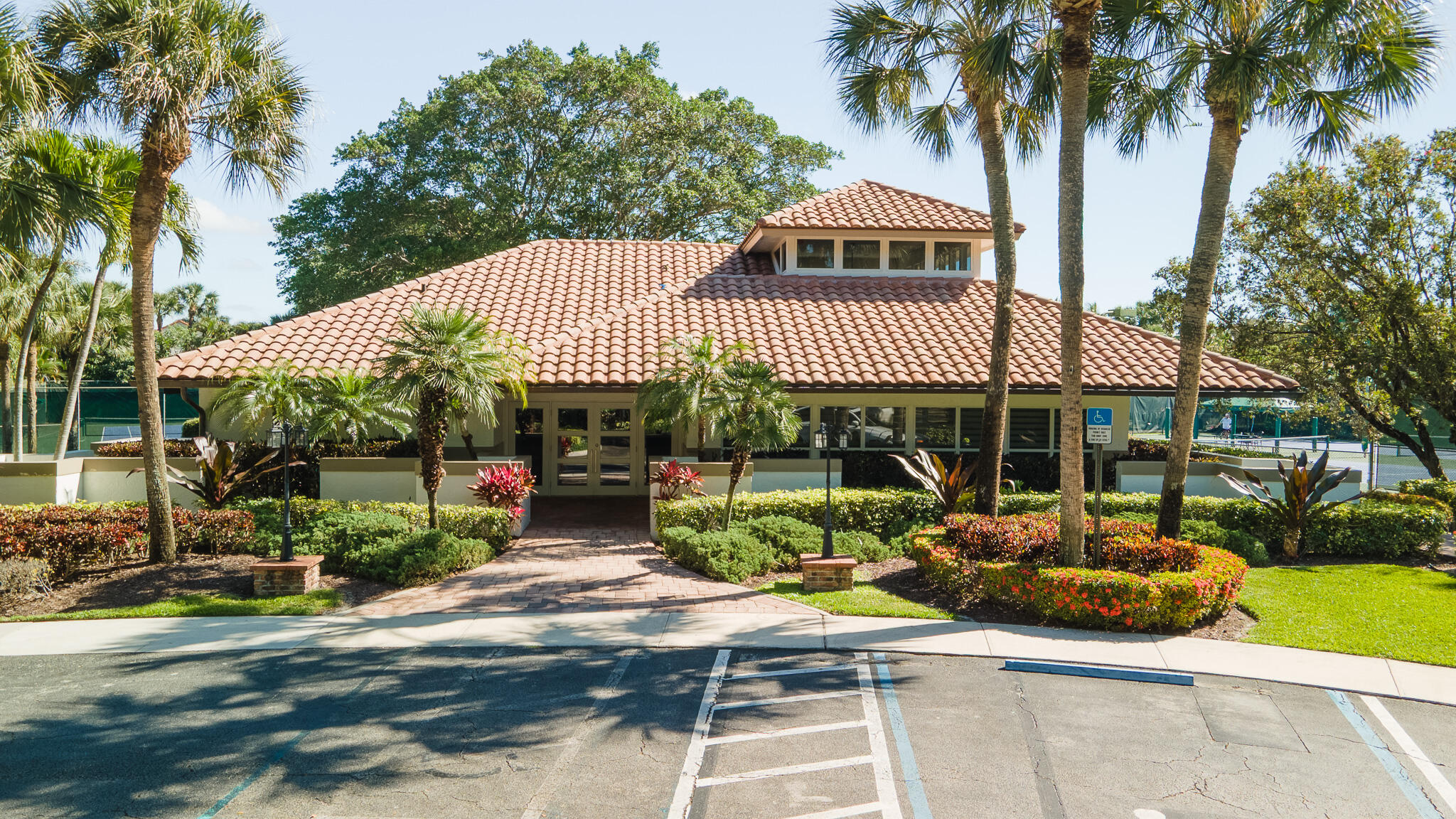 2245 Southwest 16th Place Boca Raton, FL 33486 - Photo 34 of 40 a front view of a house with garden