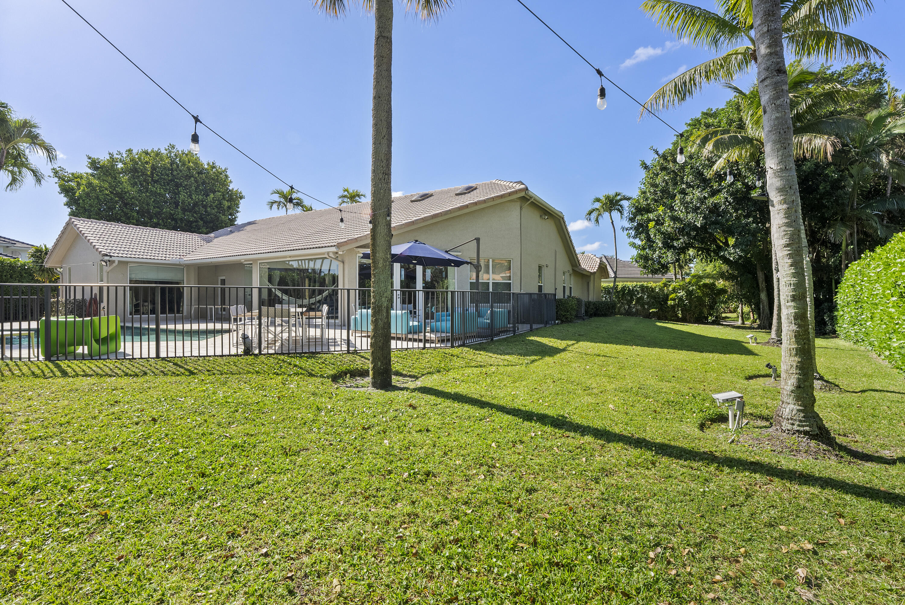 2245 Southwest 16th Place Boca Raton, FL 33486 - Photo 39 of 40 a view of a house with backyard and porch