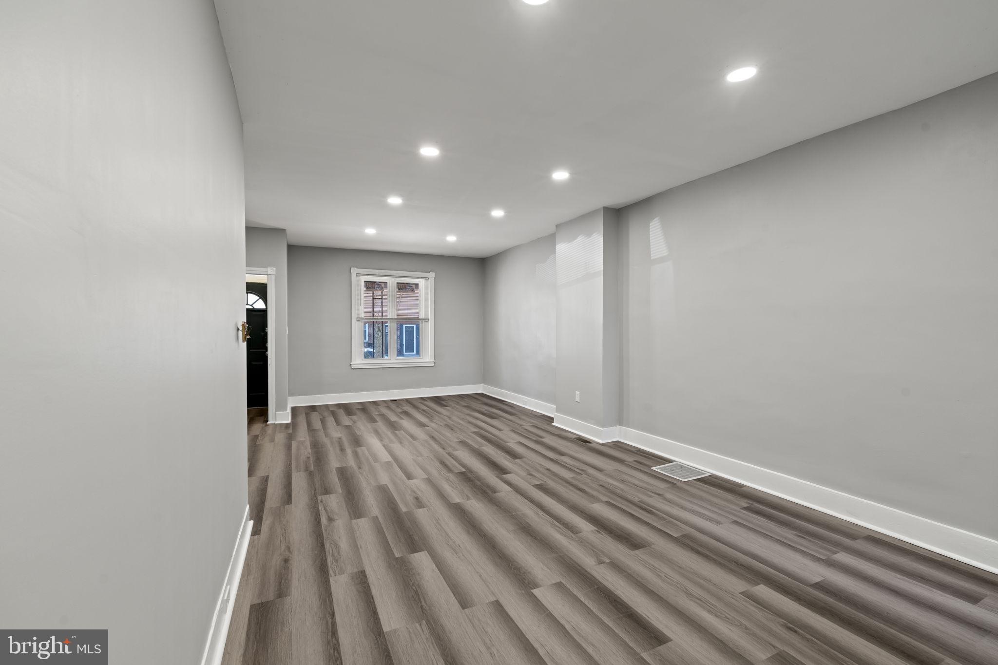 2314 West 3rd Street Chester, PA 19013 - Photo 11 of 32 a view of empty room with wooden floor