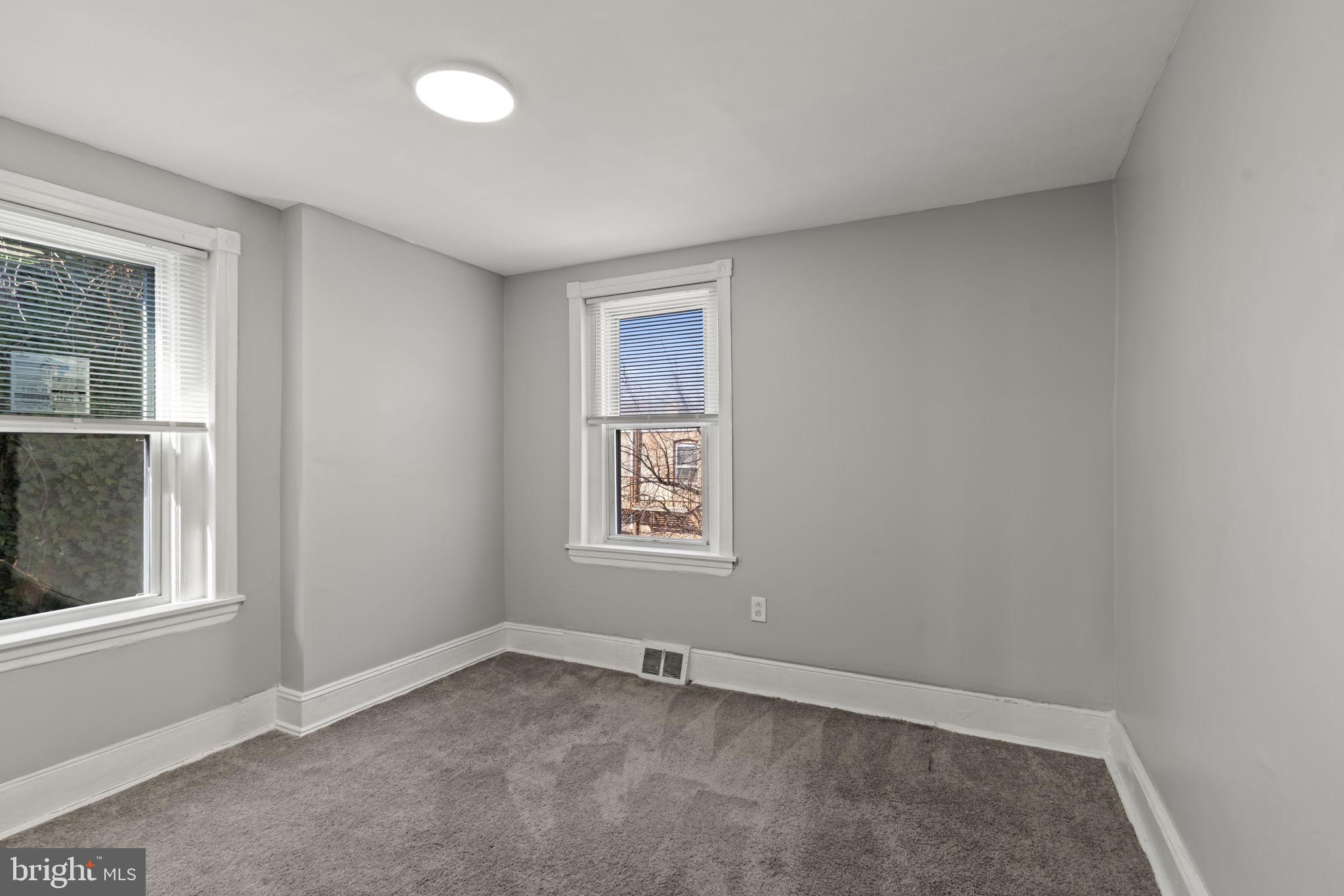 2314 West 3rd Street Chester, PA 19013 - Photo 19 of 32 an empty room with windows