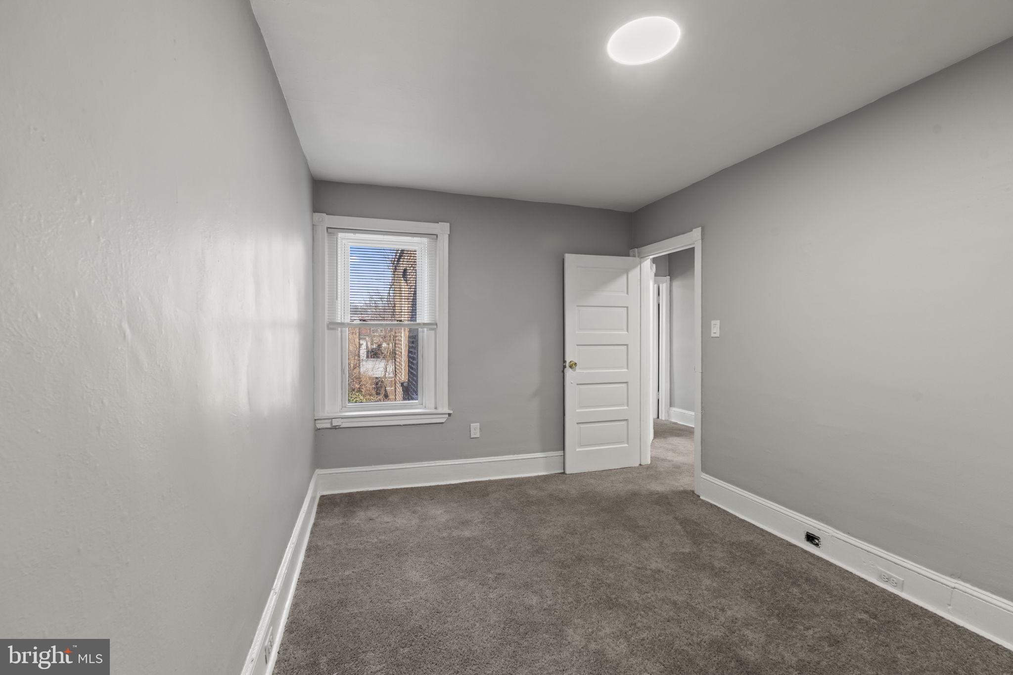 2314 West 3rd Street Chester, PA 19013 - Photo 25 of 32 an empty room with windows