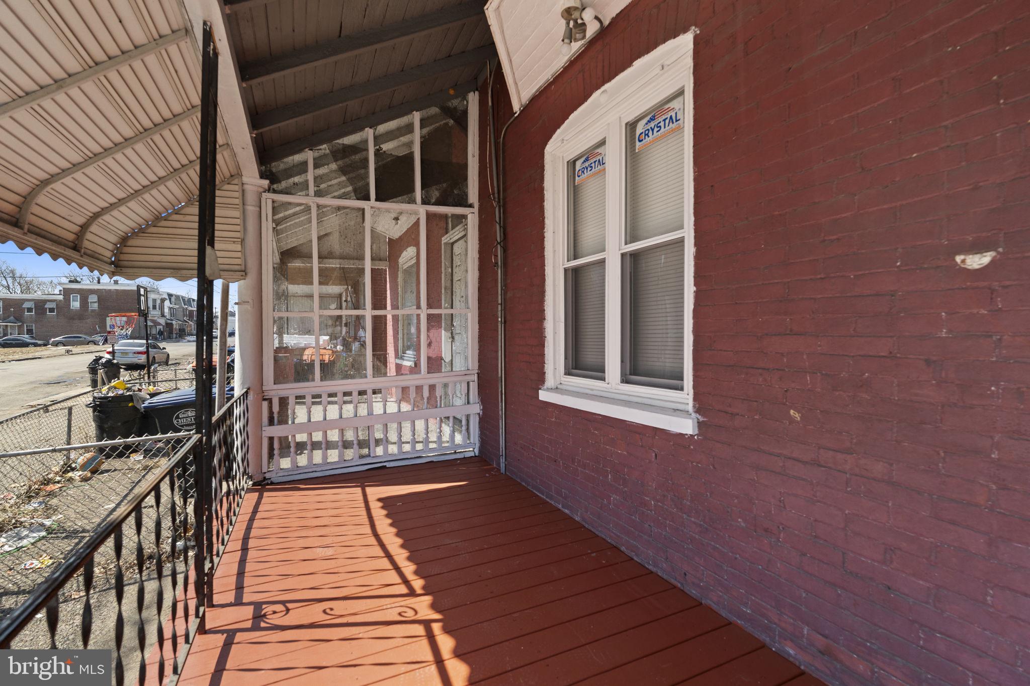 2314 West 3rd Street Chester, PA 19013 - Photo 4 of 32 a balcony with wooden floor