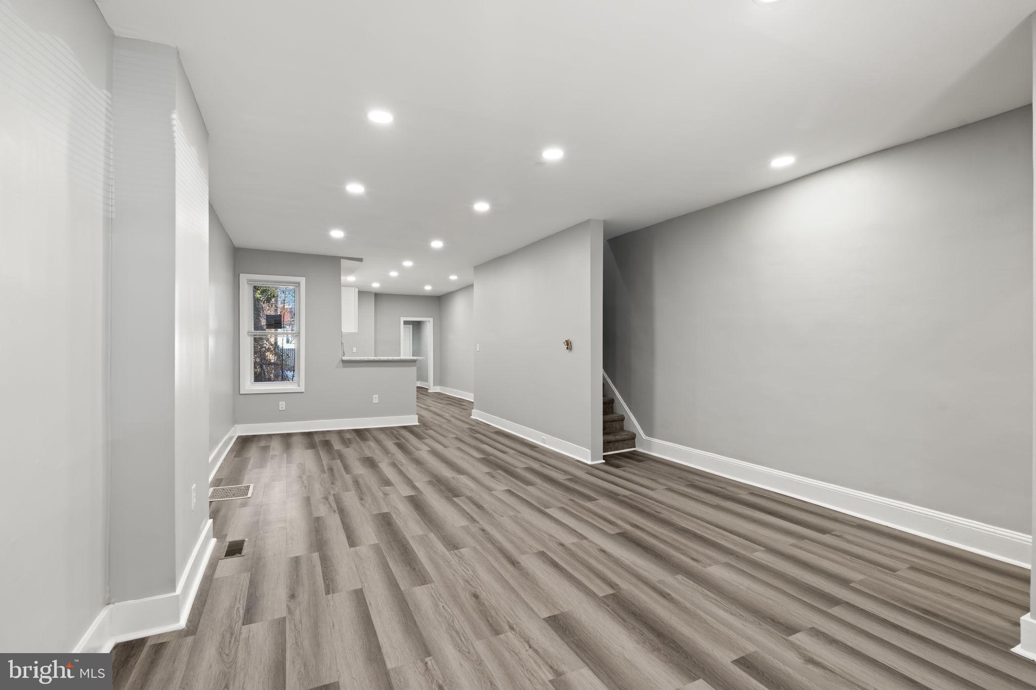 2314 West 3rd Street Chester, PA 19013 - Photo 7 of 32 a view of an empty room with wooden floor