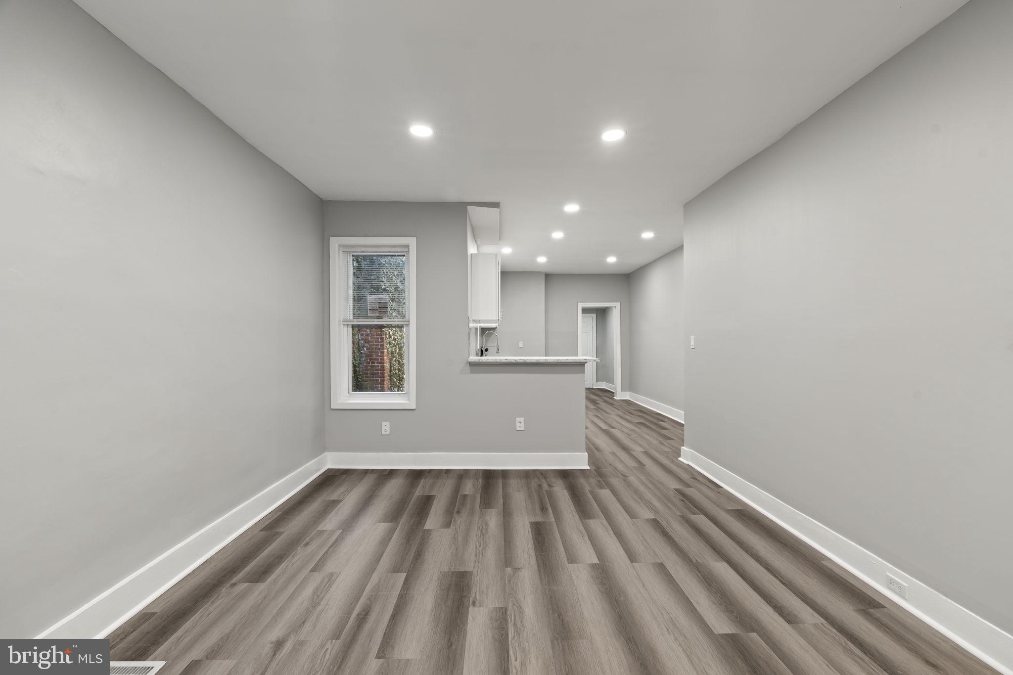 2314 West 3rd Street Chester, PA 19013 - Photo 8 of 32 a view of hallway with stainless steel appliances wooden floor and view living room