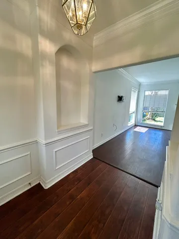 wooden floor in a an empty room with a window