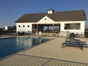 5084 Waterfront Road, Unit 6 Kerens, TX 75144 - Photo 8 of 9 a view of a swimming pool with outdoor seating
