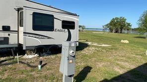 5084 Waterfront Road, Unit 6 Kerens, TX 75144 - Photo 9 of 9 a view of swimming pool with a yard